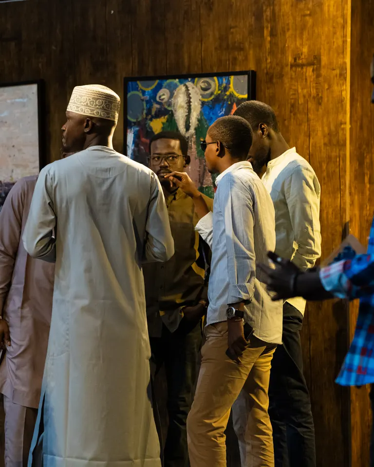 Visitors in conversation among the artworks at KAFART 2024.